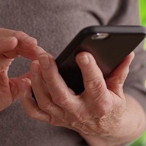 Photo of Person typing on Cellphone